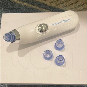 White and Blue Skincare Tool with Suction Attachments